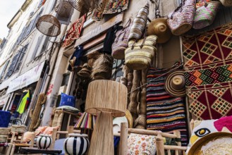 Shop exterior, lamps, carpets, baskets, Noailles, oriental neighbourhood in Marseille, France,