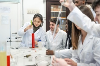 Diverse group of university chemistry students conducting an experiment in a laboratory,