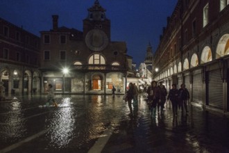 Italy Venice Church of San Giácomo di Rialto -160 right Ruga dei Orési at high tide in the evening