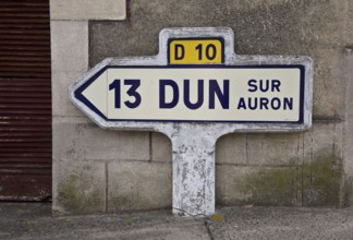 Historic ceramic and concrete signpost, D 10 13 DUN SUR AURON