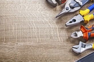 Composition of construction tools on wooden board copy space