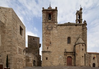 South-west façade with Plateresque main portal at the back left Torre de los Plata