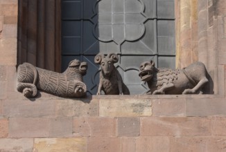 Worms, St Peter's Cathedral, east choir, figures under the large windows: lions and rams