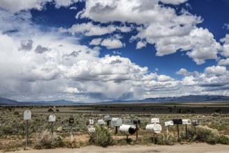 Letterboxes, mailboxes, cumulus clouds Highway 50, Loneliest Road in America, Ely, Nevada, USA,