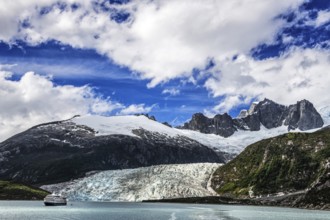 Cruise ship Stella Australis anchored in front of Pia Glacier, Cordillera Darwin, north-east