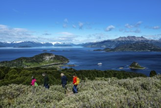 Hikers and cruise ship Ventus Australis in Wulaia Bay, Beagle Street, Ushuaia, Tierra del Fuego,