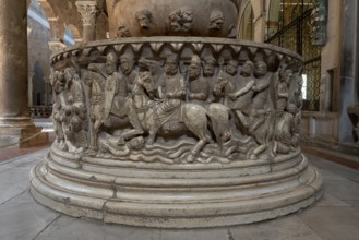 Lucca, San Frediano, north aisle, baptismal font, lower basin with scenes from the story of Moses: