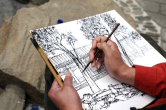 Artist with his piece of art, Beijing, China, Asia