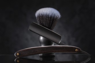 Black Barber Tools. Stright Razor And Classic Shaving Brush On Abstract Background