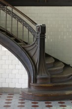 Staircase post with iron bands in Art Nouveau style