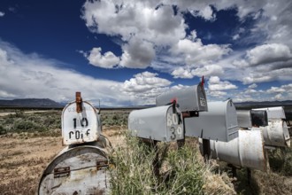 Letterboxes, mailboxes, cumulus clouds Highway 50, Loneliest Road in America, Ely, Nevada, USA,