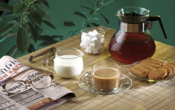 Tea time with biscuits and news paper, India, Asia