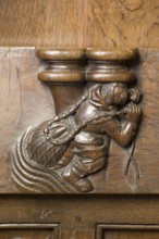 Choir stalls, drolleries on the stall sides with proverbial depictions, 1493 by Johannes Gruter