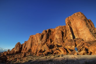 Hiker in front of Gibraltar Rock, Valley of Fire State Park, Nevada, USA, North America