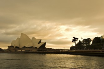 Sydney Opera Theatre at late evening with dramatic sky, Sydney, New South Wales, Australia, Oceania