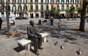 Bronze seated figure in front of his birthplace on the Plaza de la Merced