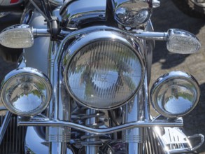 Front view of a motorbike with large, shiny chrome headlights, Appelhülsen, münsterland, germany