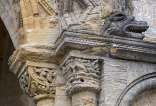 Sherborne Abbey, south doorway, battle zone, capital with leaf mask and monster