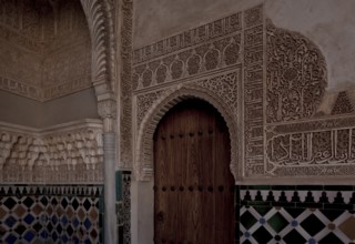 Nasrid Palace, wall design around a door with stucco framing and tiled plinth