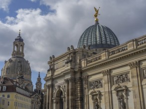 Historic architecture with dome and angel figure in front of a cloudy sky, dresden, saxony, germany