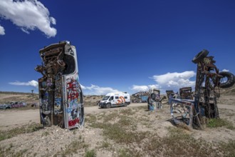 Motorhome and scrap cars decorated with graffiti in the Carforest of Goldfield, Nevada, USA, North