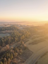 Sunrise over a wintry landscape with forests and fields, Gechingen, district of Calw, Black Forest,