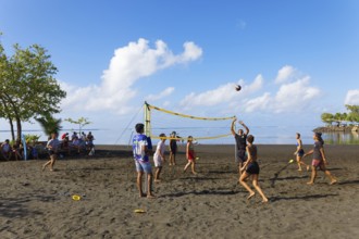 Young people playing volleyball on the beach, black, sand, Matavai Bay, Pointe Venus, Mahina