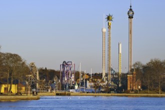 Amusement park with various rides under a clear sky, Djurgarden, Stockholm, Sweden, Europe