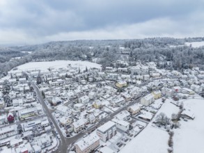 Snow-covered settlement surrounded by wooded hills and wintry sky, Aidlingen, Böblingen district,