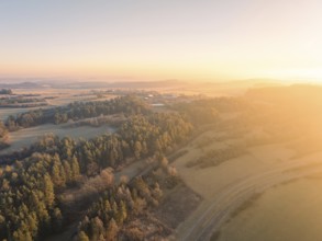 Sunrise over a wintry landscape with forests and fields, Gechingen, district of Calw, Black Forest,