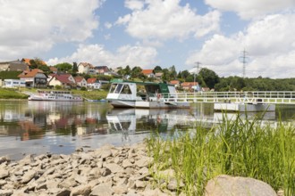 Ferryboat Stolzenfels at the pier in Diesbar-Seußlitz on the banks of the Elbe, in the background