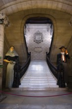 Staircase with traditional giant figures, citizen and citizeness, Gigantes, historic town hall,