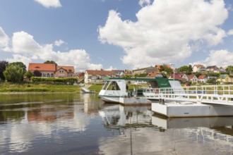 Ferryboat Stolzenfels at the pier in Diesbar-Seußlitz on the banks of the Elbe, in the background