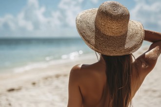 Back view of tan woman in summer straw hat at beach. Generative AI, AI generated