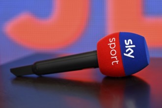 Close-up, microphone, mike, SKY, logo, background blue orange, lying on table, reflection,