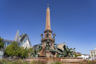 The Mende Fountain and the modern Augusteum of the University of Leipzig on Augustusplatz, Leipzig,