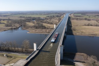 Barge at Magdeburg waterway junction, Mittelland Canal crosses Elbe in trough bridge, longest canal