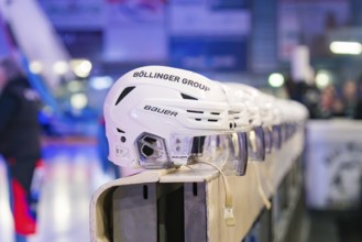 Row of white ice hockey helmets framed in a sports hall, Heilbronner Falken Vs Bietigheimer