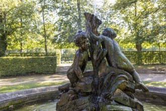 Fountain with group of giant children in Zabeltitz Castle Park, Großenhain, Saxony, Germany, Europe