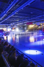 Ice hockey match in the stadium with illuminated ice surface and full crowd, Heilbronner Falken Vs