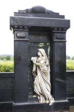 Historical grave with figure of a praying woman, cemetery of the Emmaus Church in Kaditz, Dresden,