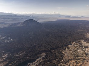 Volcano in the distance, surrounded by a vast landscape under a clear sky, Argentina, volcanoes,