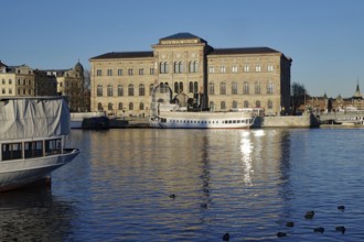 Historic building on the waterfront with boats and clear blue sky, Museum, Stockholm, Sweden,