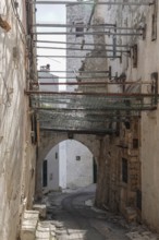 Alley in the historic centre of Ostuni, securing historic building, Ostuni, Apulia, Italy, Europe