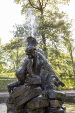 Fountain with group of giant children in Zabeltitz Castle Park, Großenhain, Saxony, Germany, Europe