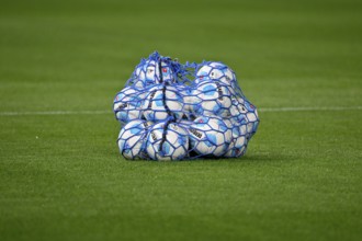 Adidas Derbystar match balls in the ball net lying on the grass, MHPArena, MHP Arena Stuttgart,