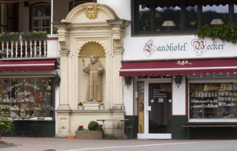 Souvenir shops and statue of St Francis, St, Saint, Saint