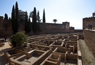 Alcazaba fortress, inner courtyard with Torre de la Vela, building floor plans exposed below