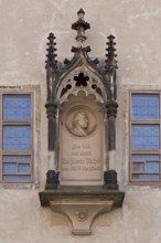 Tracery canopy on the outside between the windows of the Luther Room, containing a medallion with a