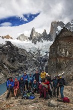 Climbing group in front of Laguna de los Tres with a view of the summit of Fitzroy, El Chaltén, Los